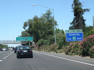 Stay left to follow Business 80 east and California 51 north to the UC Davis Medical Center, a major regional hospital and medical research center located in Sacramento. Take Business 80 east, exit onto T Street going east, and connect to Stockton Boulevard southeast to the medical center.