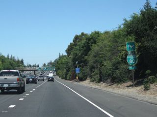 A second trailblazer sign for Sacramento International Airport correctly advises motorists to use Business 80 west to Interstate 5 north.