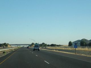 Sacramento County Route E-14 is an east-west arterial that follows Elkhorn Boulevard from California 99 east to Interstate 80 via North Highlands and Foothill Farms. At Interstate 80, CR E-14 transitions directly onto Greenback Lane (name change). E-14/Greenback Lane then travels east to Orangevale, ending at CR E-3 (Hazel Avenue). Greenback Lane continues east all the way to Folsom where it meets Folsom Boulevard, crosses the American River via the historic Rainbow Bridge, and ends in Old Folsom.