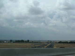 Traffic from California 99 north merges onto California 149 north from the right.