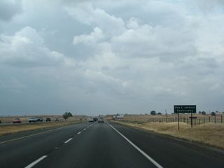 Between Exits 376 and 383, California 99 reverts to a four-lane expressway that intersect with three at-grade intersections: Neal Road (Exit 378), Estates Drive (Exit 380), and Southgate Avenue and Entler Avenue (Exit 382). This section of California 99 is designated as Ray E. Johnson Expressway.