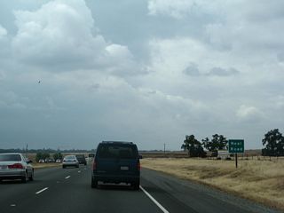 Northbound California 99 approaches its at-grade intersection with Neal Road (which would be Exit 378 if ever upgraded to an interchange).