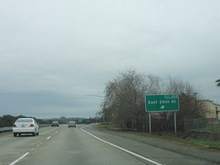 Northbound California 99 meets Exit 384, East 20th Street.