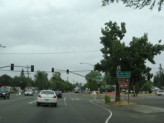 Northbound California 99 (old U.S. 99E) meets Pennington Road in downtown Live Oak. On the southeast corner of this intersection is the Live Oak city hall. Turn left for Pennington Road west to the Gray Lodge Wildlife Area in Butte County. Turn right for Pennington Road east to the Live Oak Recreation Area for camping and boating.