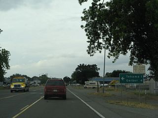 After passing through the center of Los Molinos, northbound California 99 approaches Tehama County Route A-8 (Aramayo Way), which travels west across the Sacramento River to the community of Tehama. Once in Tehama, CR A-8 will turn north on Fifth Street and eventually find its way to Red Bluff, merging with Old Highway 99W in Proberta and with Business Loop I-5 near Red Bluff. At the same intersection, Tehama County Route A-11 will begin its journey south and west along Gyle Road to Interstate 5 Exit 636.