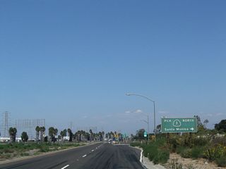 Southern California Edison power lines parallel the west side of the Terminal Island Freeway where the loop ramp for SR 1 (Pacific Coast Highway) northbound to Santa Monica departs.