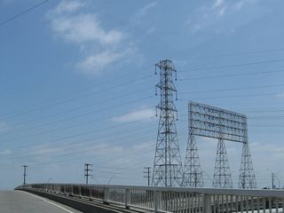 Towering Southern California Edison power lines, including an 12-circuit 69kV tower, cross over the Anaheim Street overcrossing that was built in 1947.