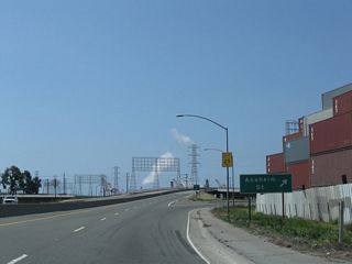 A parclo interchange connects SR 103 south with Southern Pacific Drive and I Street east to Anaheim Street.