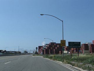 A loop ramp joins SR 103 (Terminal Island Freeway) south with SR 1 (Pacific Coast Highway) southbound. Traveling east, SR 1 separates with Westside neighborhood in Long Beach with industrial areas to the south en route to Signal Hill.