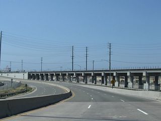 SR 47 combines with SR 103 (Terminal Island Freeway) south from Henry Ford Avenue at a wye interchange adjacent to the Alameda Corridor railroad.