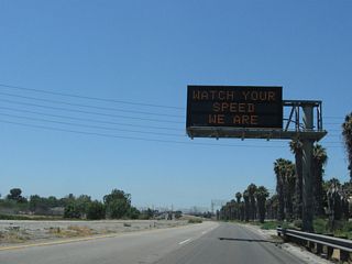 California 103 (Terminal Island Freeway) begins as a four-lane freeway. Constructed in 1947 and 1948, it retains older highway design standards.