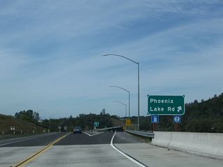 Westbound California 108 (Sonora Bypass) meets the off-ramp to Phoenix Lake Road.