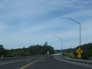 The two-lane freeway continues along California 108 (Sonora Bypass) west.