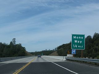 Crossing over Sullivan Creek, westbound California 108 (Sonora Bypass) approaches the junction with California 108 Business (Mono Way) (0.25 mile). California 108 Business, which currently begins at Peaceful Oak Road, extends along Old California 108 from that intersection west into downtown Sonora. Between Peaceful Oak Road and the upcoming interchange, California 108 Business passes under its parent roadway, then meets California 49 in downtown Sonora.