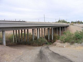 From the south side of California 115 is this view of the Alamo River bridge in western Holtville.