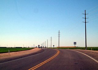 This view looks north on California 115 and west on Historic U.S. 80 after the intersection with Historic U.S. 80 east and Interstate 8. Notice how green these fields are, thanks to irrigation water from the Colorado River via the Highline Canal.