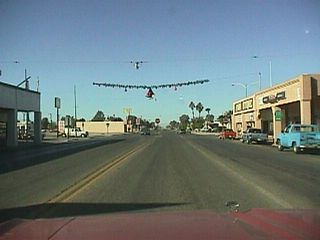 After entering Calipatria, northbound California 115 approaches California 111 and Imperial County Route S-30.