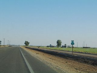 A reassurance shield for California 115 is posted after the change in directions at Wiest Road/Wirt Road.