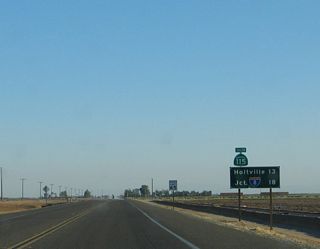 After separating from California 78, this mileage sign provides the distance to Holtville and Interstate 8.
