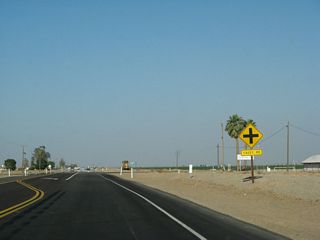 Eastbound California 78 and southbound California 115 approach their intersection with Casey Road.