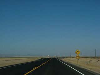 At this point, California 115 turns from east to south. A trailblazer points the way south on California 115.