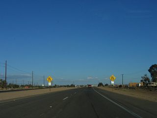 A second lane constriction sign is posted soon thereafter.