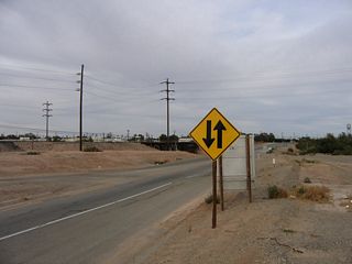 Traffic is again two-lanes at the conclusion of the expressway section of California 115.