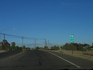 Old U.S. 80 and California 115 (Evan Hewes Highway) make a turn to the north in order to enter downtown Holtville via Palm Avenue. A right turn here connects to eastbound Fourth Street.