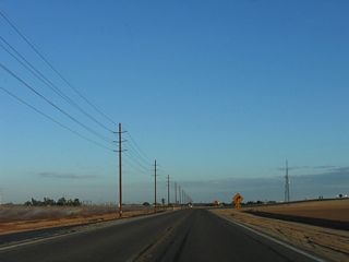 The IID power lines follow California 115 for a short distance, until the point where Historic U.S. 80 turns east just prior to the Interstate 8 interchange.