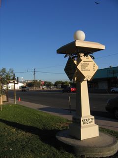 Holt Park, located in downtown Holtville, is situated on the north side of Fifth Street (California 115 and Historic U.S. 80). At the south end of the park is a replica Automobile Club of Southern California (ACSC) mileage marker with four faces mounted on a pillar.