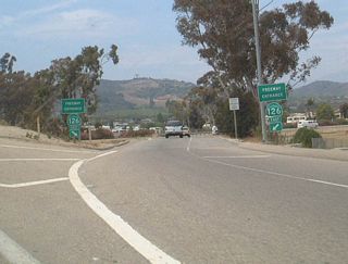 Coming into the final mile, westbound California 118 approaches California 126 (Santa Paula Freeway). California 126 travels west to Ventura and east to Santa Clarita. This busy freeway directly connects to U.S. 101 a few miles west of here.