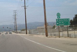 About nine miles further west, California 118 (Los Angeles Avenue) meets California 232 (Vineyard Avenue). Turn left to follow California 232 southwest to U.S. 101, California 1, and Oxnard. The California 118 west control city is listed here as Santa Paula, although California 118 ends in Saticoy. The reason for this is that through traffic is encouraged to take California 232 rather than follow California 118 and California 126 to U.S. 101 (Ventura Freeway).
