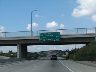 This mileage sign provides the distance to the next four exits along California 118 (Ronald Reagan [Simi Valley] Freeway) west and California 23 (Moorpark Freeway) south: Exit 19A, Princeton Avenue; Exit 18B, California 23 north and California 118 (Los Angeles Avenue) west; Exit 18A, California 23 (Moorpark Freeway) south (left exit); and California 23's Exit 19, Tierra Rejada Road.