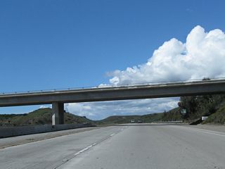 West Hills Court passes over California 118; this bridge accesses a landfill located on the north side of California 118.