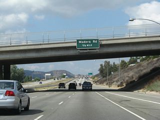 The next interchange along California 118 (Ronald Reagan [Simi Valley] Freeway) is Exits 22B-A, Madera Road.