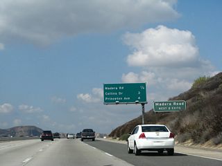 This mileage sign along California 118 west provides the distance to the next four exits: Exits 22B-A, Madera Road; Exit 19B, Collins Drive; and Exit 19A, Princeton Avenue.