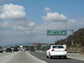 Westbound California 118 (Ronald Reagan Freeway) reaches Exit 22B, Madera Road north. The next right is Exit 22A, Madera Road south to El Rancho Simi and the Reagan Presidential Library.