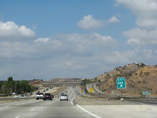 The gore point for Exit 22A is marked with an exit number.