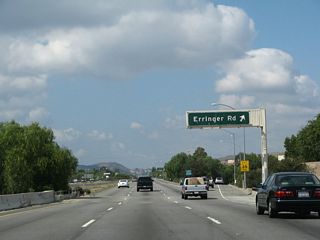 Westbound California 118 (Ronald Reagan [Simi Valley] Freeway) reaches Exit 24, Erringer Road.