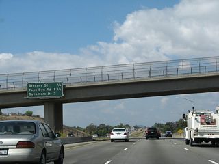 This mileage sign along California 118 (Ronald Reagan Freeway) west provides the distance to the next three exits: Exit 28, Stearns Street; Exit 27, Tapo Canyon Road; and Exit 25, Sycamore Drive.