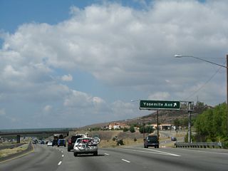 Westbound California 118 (Ronald Reagan Freeway) reaches Exit 29, Yosemite Avenue. By 2011, this sign was replaced with an overhead exit number sign.