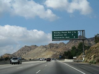 This mileage sign provides the distance to the next three exits along California 118 (Ronald Reagan [Simi Valley] Freeway) west: Exit 32, Rocky Peak Road; Exit 30, Kuehner Drive; and Exit 29, Yosemite Avenue.