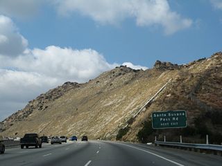 Use Exit 32 to Santa Susana Pass Road, which is old California 118 and parallels the freeway. A massive rock cut allows the freeway to proceed uphill.