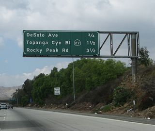 This mileage sign provides the distance to the next three exits along California 118 (Ronald Reagan [Simi Valley] Freeway) west: Exit 35, DeSoto Avenue; Exit 34, California 27 (Topanga Canyon Boulevard); and Exit 32, Rocky Peak Road.