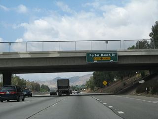 As traffic merges onto the freeway from Tampa Avenue. The right lane of California 118 (Ronald Reagan [Simi Valley] Freeway) west becomes exit only for Exit 36, Porter Ranch Road.