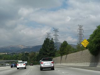 The right lane of California 118 (Ronald Reagan [Simi Valley] Freeway) west becomes exit only for Exit 40A, Balboa Avenue. Three power transmission towers (owned by Los Angeles Department of Water and power) approach the freeway and will run parallel to it as we continue west.