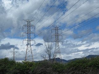 A set of Los Angeles Department of Water and Power transmission lines cross over the freeway.