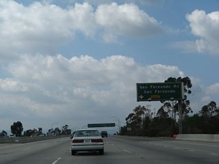 The right lane of California 118 (Simi Valley Freeway) west becomes exit only for Exit 44B, San Fernando Road (old U.S. 6-99); Exit 44A, Interstate 5 (Golden State Freeway); and Exit 42B, Interstate 405 (San Diego Freeway). U.S. 99 followed San Fernando Road until the Golden State Freeway opened in stages through the late 1950s and early 1960s. As the freeway opened, the old alignment on San Fernando Road was redesignated as U.S. 6-99 Business. When both U.S. 6 and U.S. 99 were eliminated in Los Angeles in the mid-1960s, the old alignment was renumbered as Business Loop I-5. The business designation was retired in the late 1980s as most know the historic route as San Fernando Road without any additional route number.
