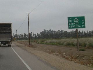 This mileage sign is posted after the California 34 (Somis Road) intersection and provides the distance to California 232 (Vineyard Avenue), Saticoy and Ventura (16 miles via California 126 west and U.S. 101 north).