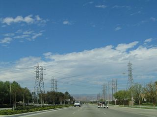 A wide variety of power lines cross Magic Mountain Parkway after the Fairways intersection.
